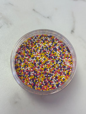 ROUND SPRINKLES PURPLE, YELLOW, WHITE, AND PINK