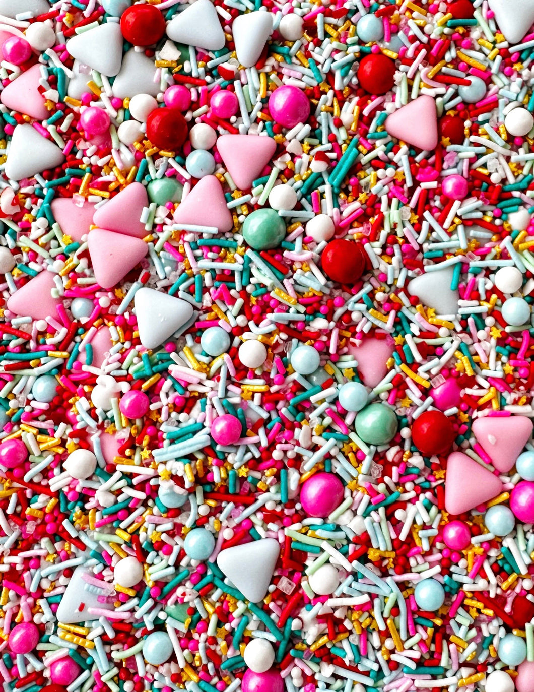 VARIETY SHAPED SPRINKLES INCLUDING ROUND AND TRIANGLE SHAPED TEAL RED LIGHT PINK HOT PINK WHITE LIGHT TEAL